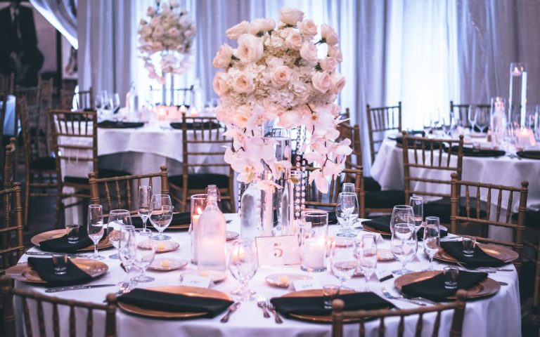 Pink and white roses centerpiece at a reception