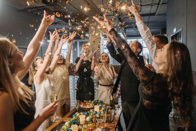 Colleagues celebrating with confetti at a corporate party