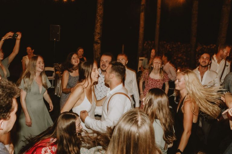 Guests dancing at an outdoor wedding reception