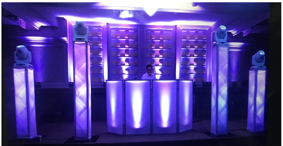 Contemporary DJ package setup with LED booth and uplighting at a wedding reception